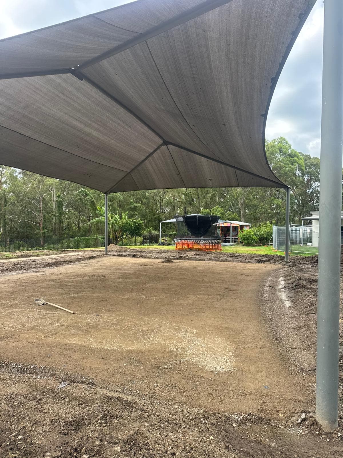 Compacted platform under shade sail