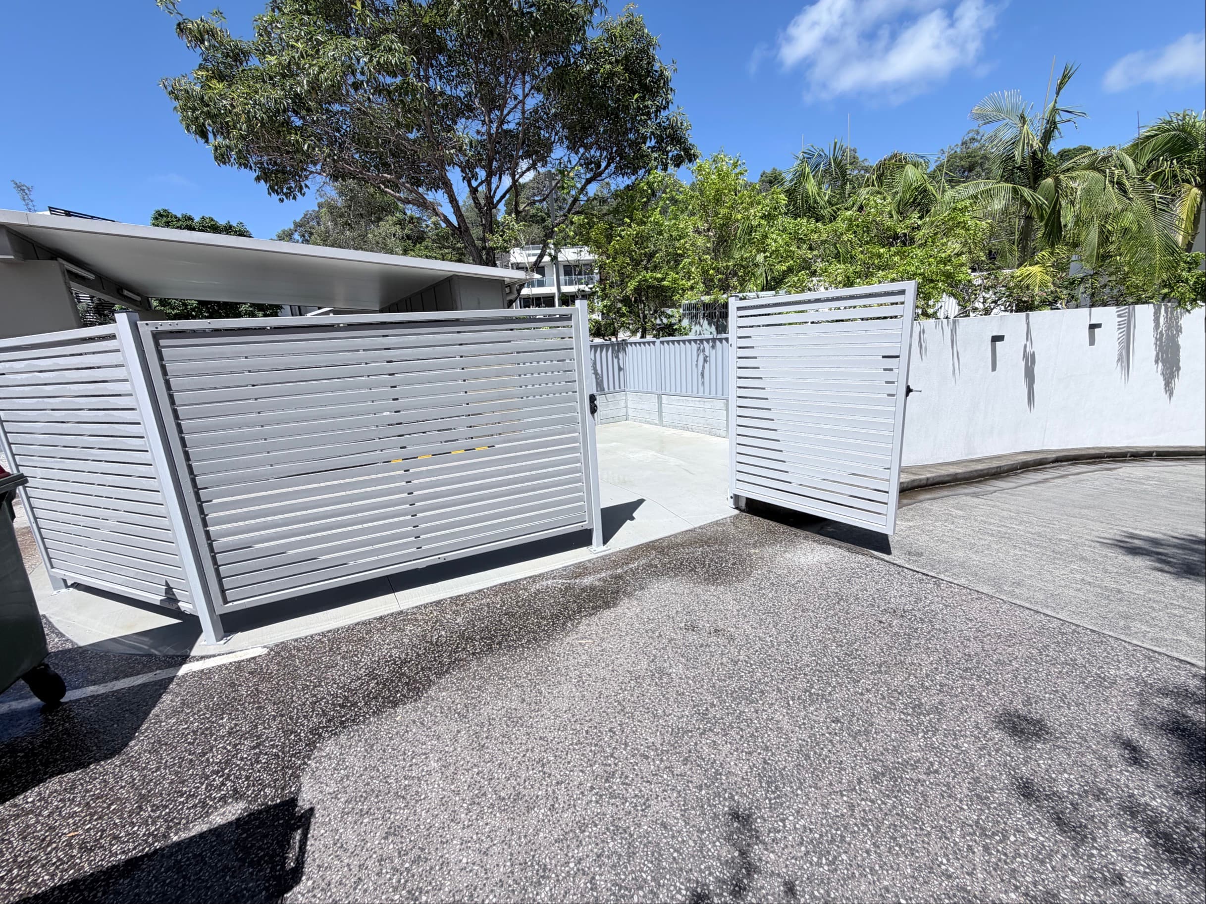 Completed enclosure gates open showing access
