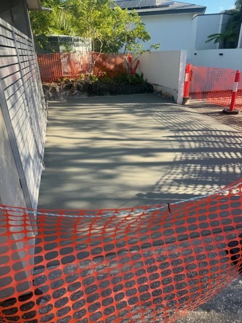 Freshly poured and finished concrete slab during curing