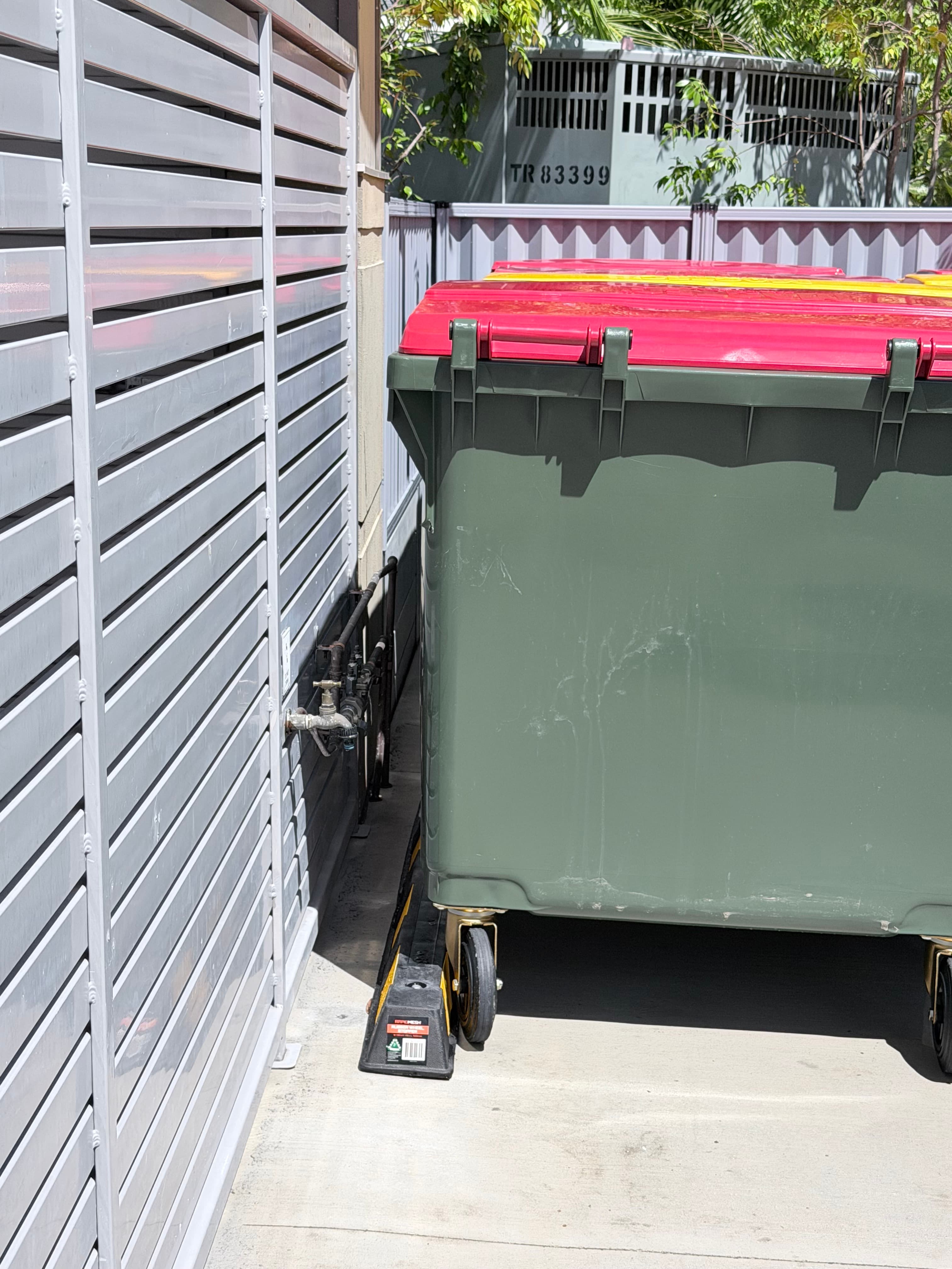 Bins inside enclosure viewed from gate