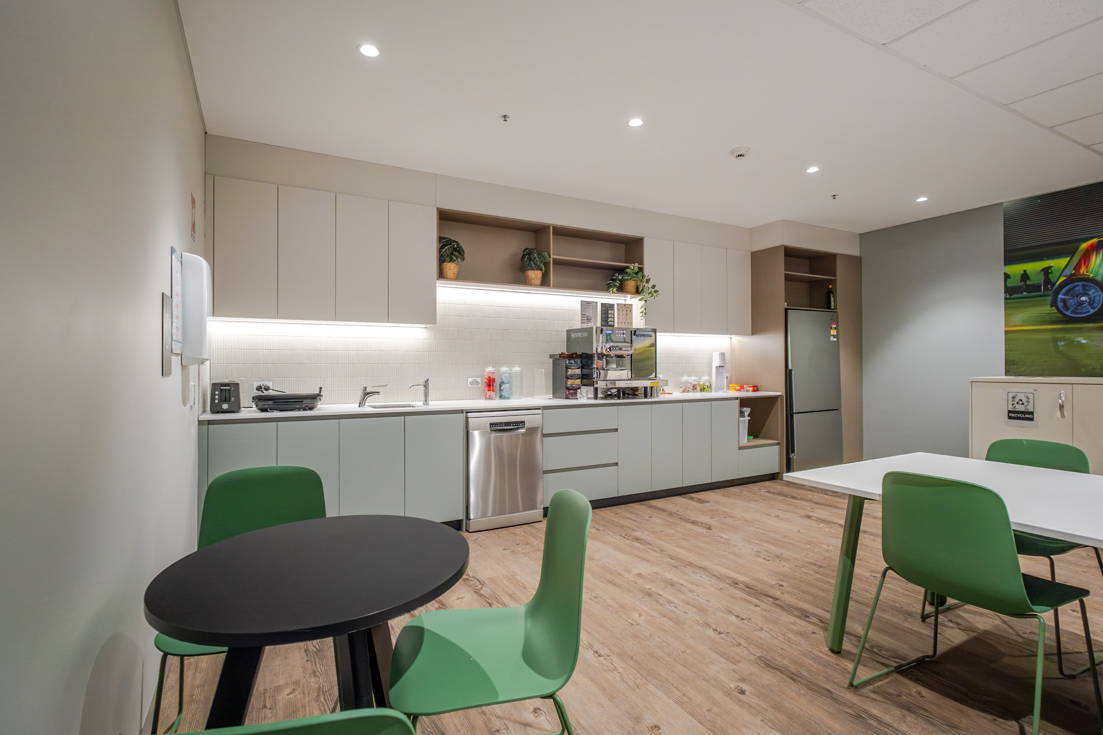 Toyota Customer Relations Office - kitchen and breakout dining area with timber flooring and living wall